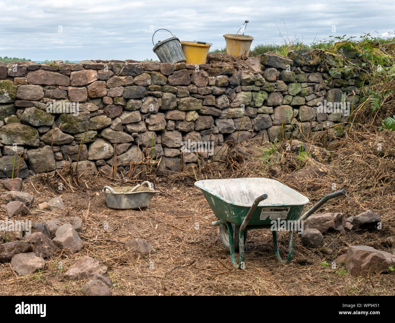 Old drystone wall repair works, Derbyshire, England, UK Stock Photo