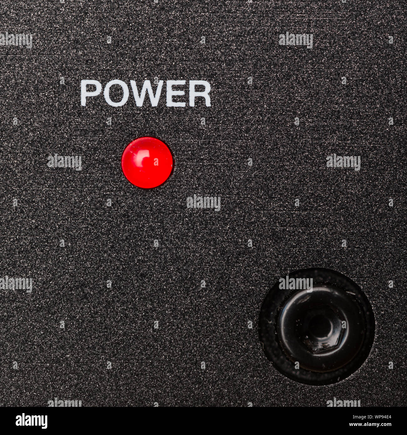 Power indicator, red led on metal panel Stock Photo