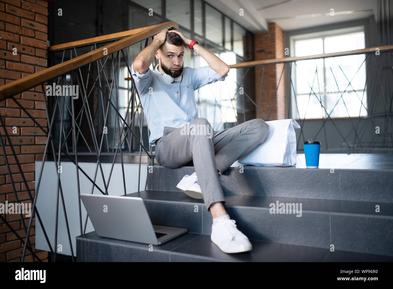 Freelancer feeling overloaded while having difficult task Stock Photo