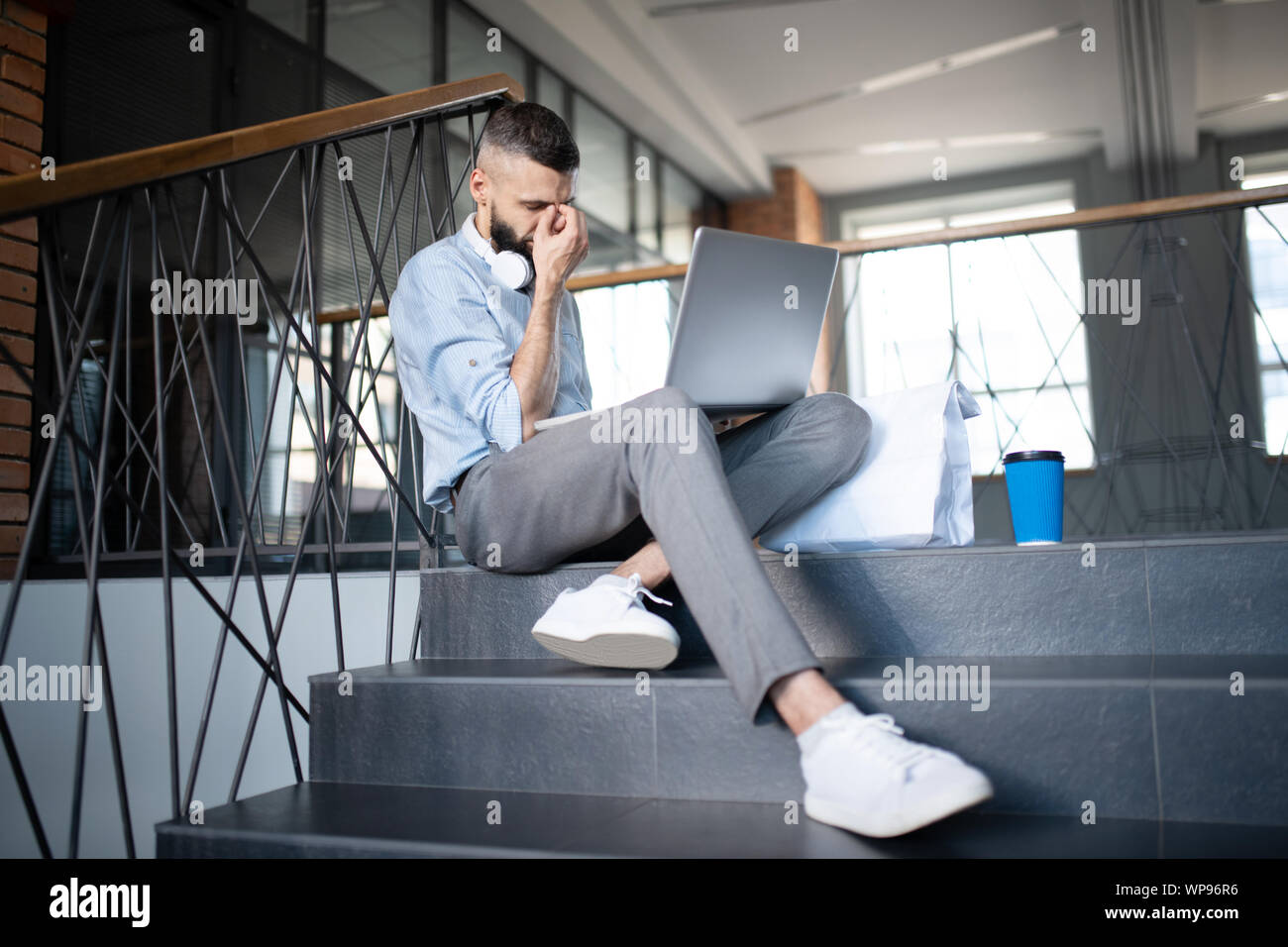 Freelancer feeling sleepy after working for too long Stock Photo