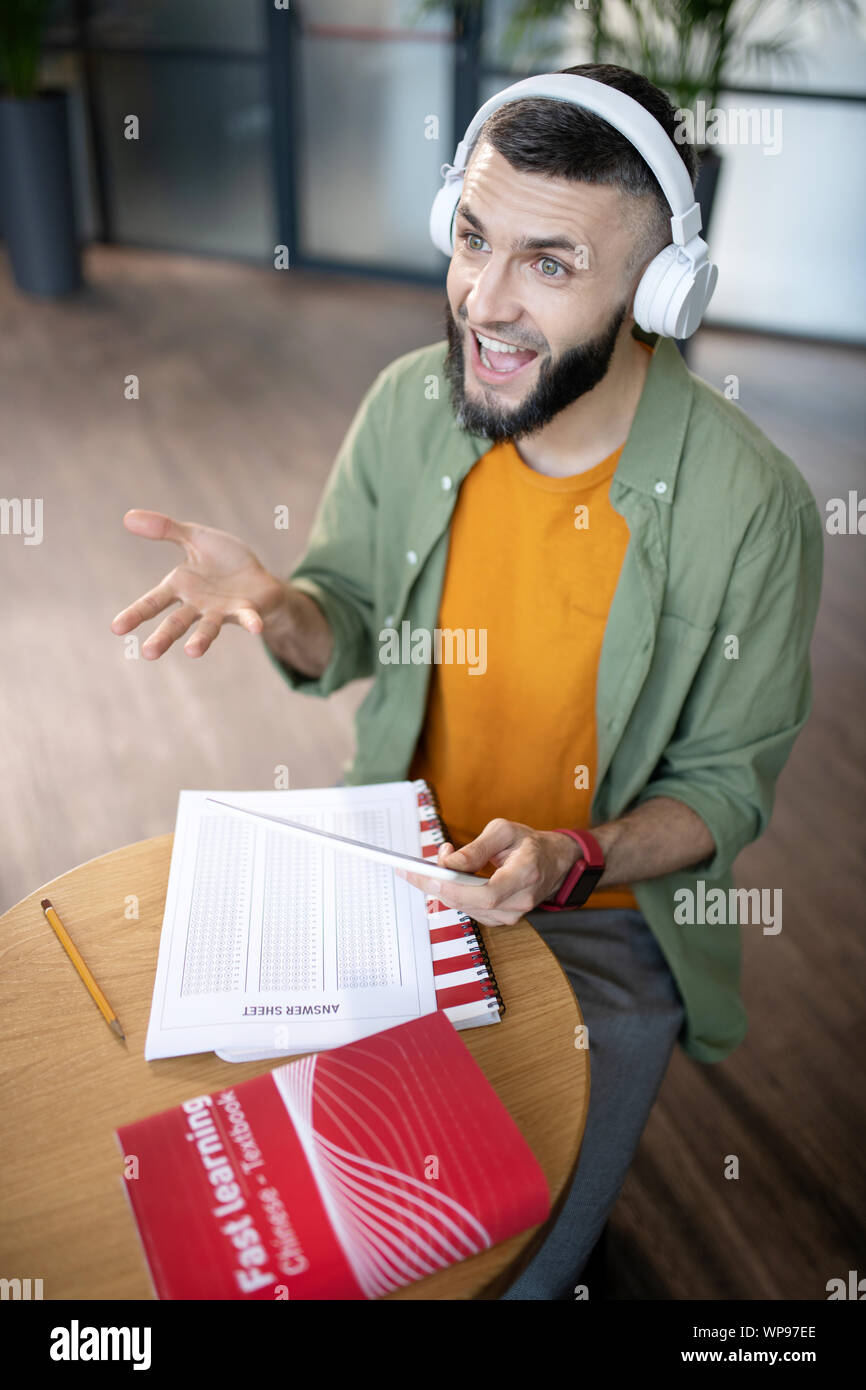 Student feeling joyful while studying foreign language Stock Photo