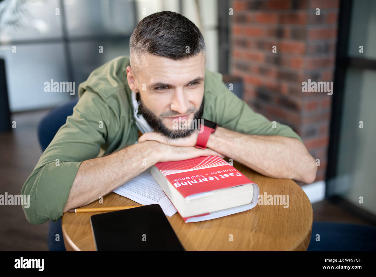 Bearded student feeling excited before passing language exam Stock Photo