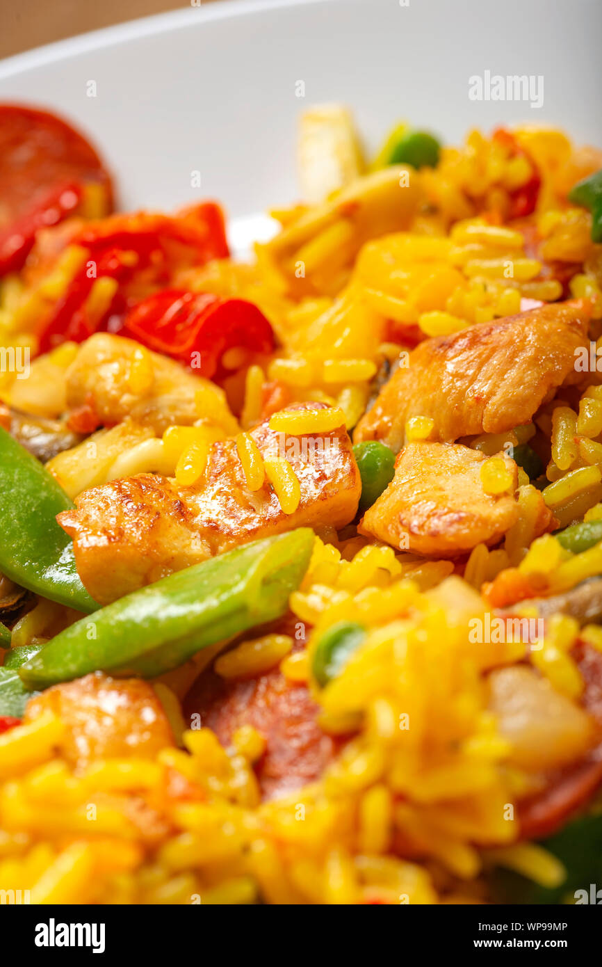 Traditional Spanish paella with seafood and chicken meat - close up view Stock Photo
