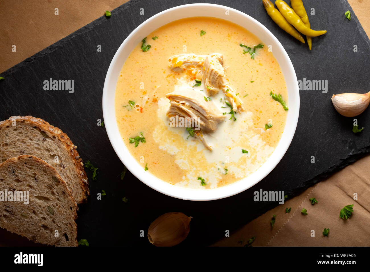 Ciorba radauteana - Romanian traditional chicken soup with cream and garlic - top view Stock Photo