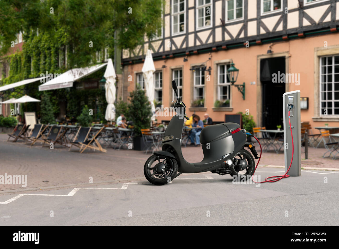 Electric scooter for sharing with charging station on a city street