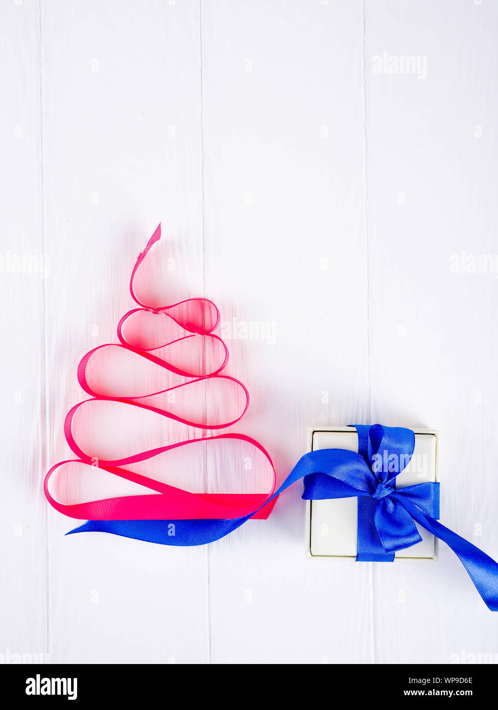Christmas tree satin pink ribbon, on white background, copy space ...