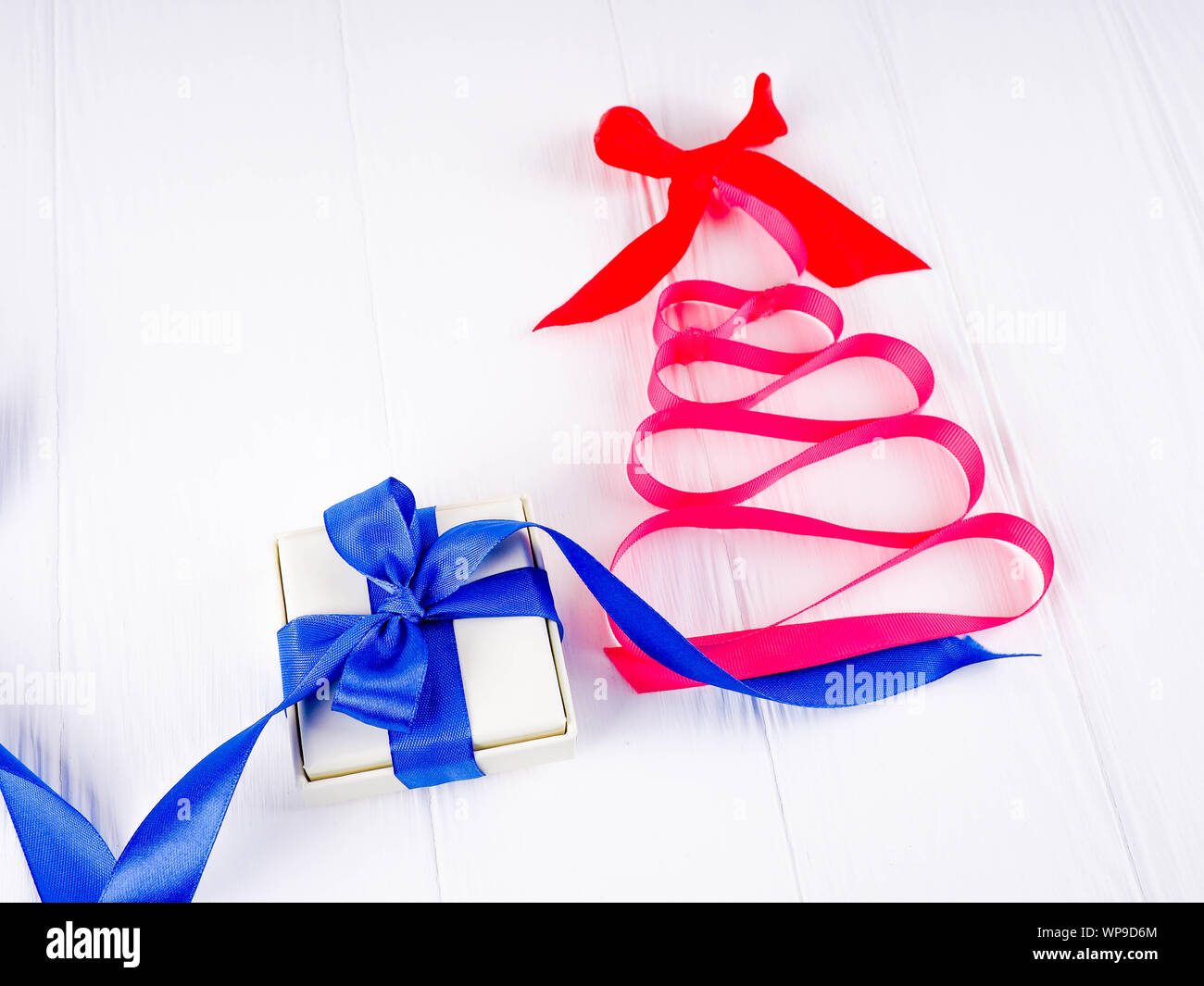 Christmas tree satin pink ribbon, on white background, copy space ...