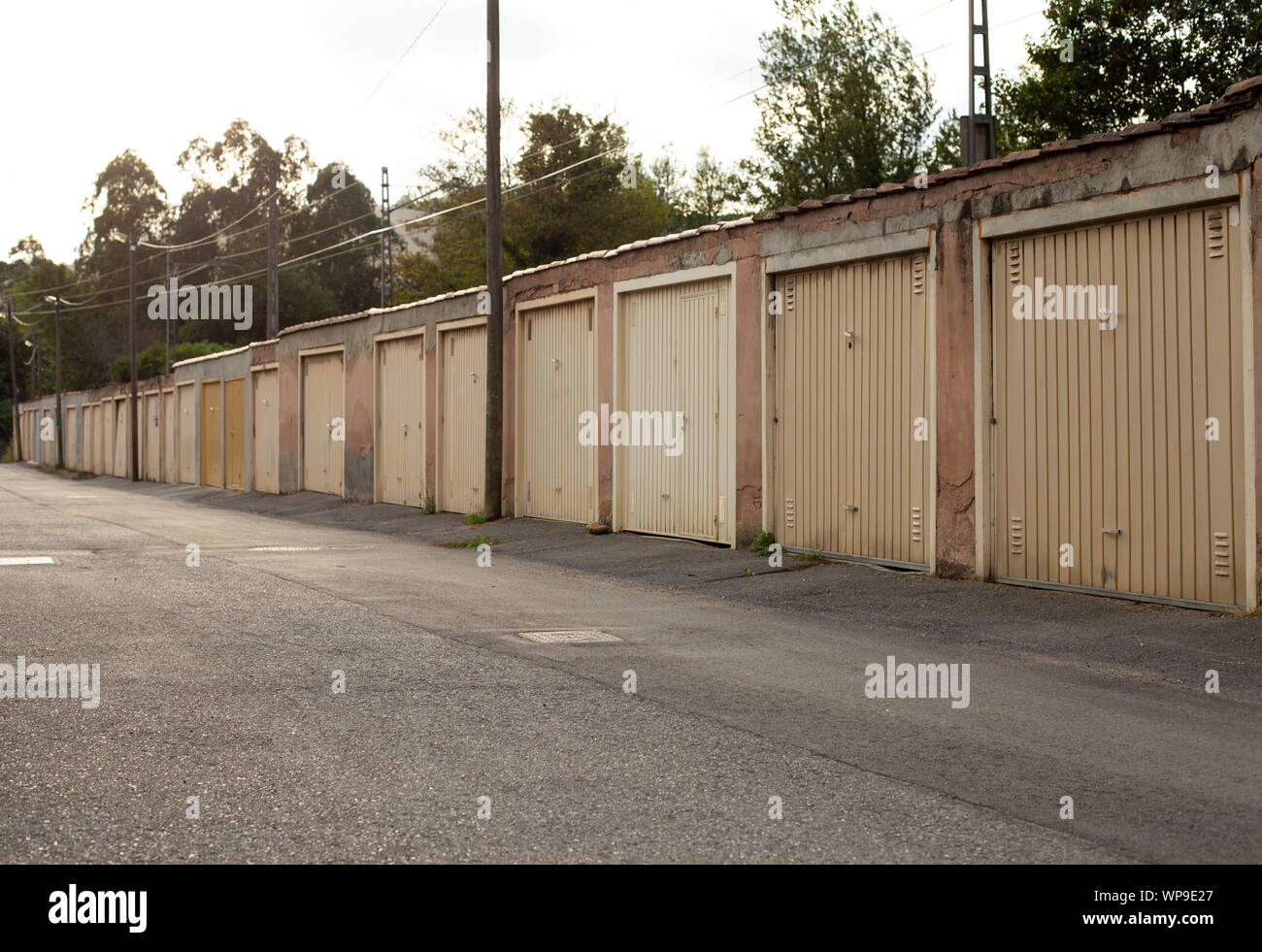 Row of old garages at daytime Stock Photo