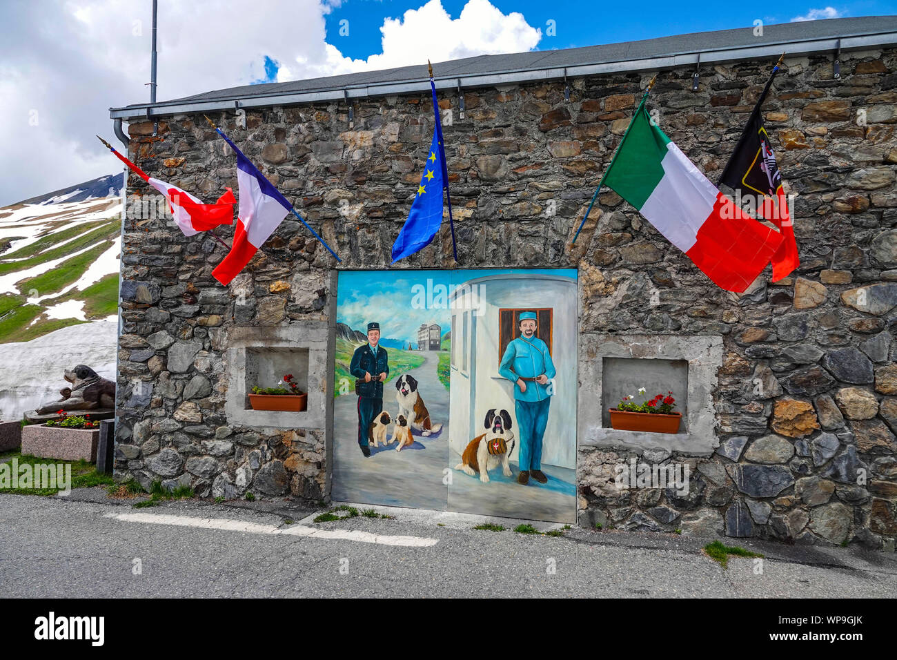 Mural with flags Springtime on the Col de Petite Saint Bernard, between ...