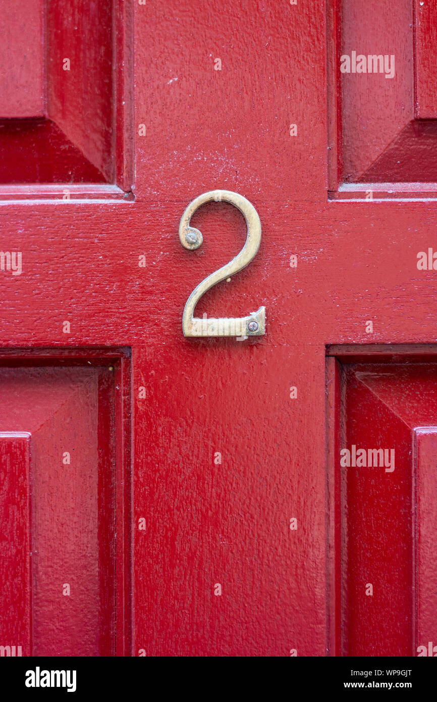 House number 2 on a bright red wooden front door Stock Photo - Alamy
