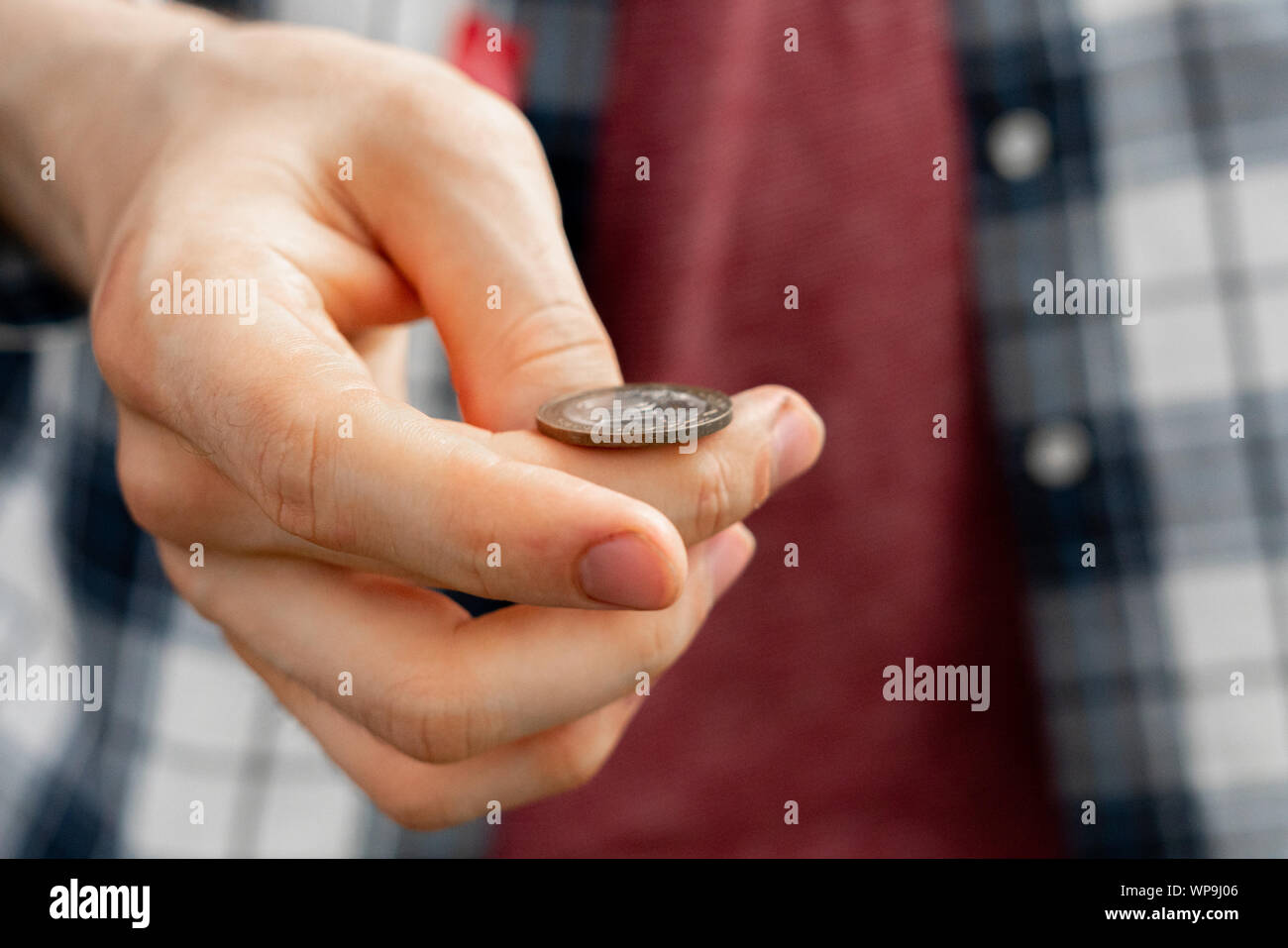 close up shot of hand toss a coin, probable and winning chances concept