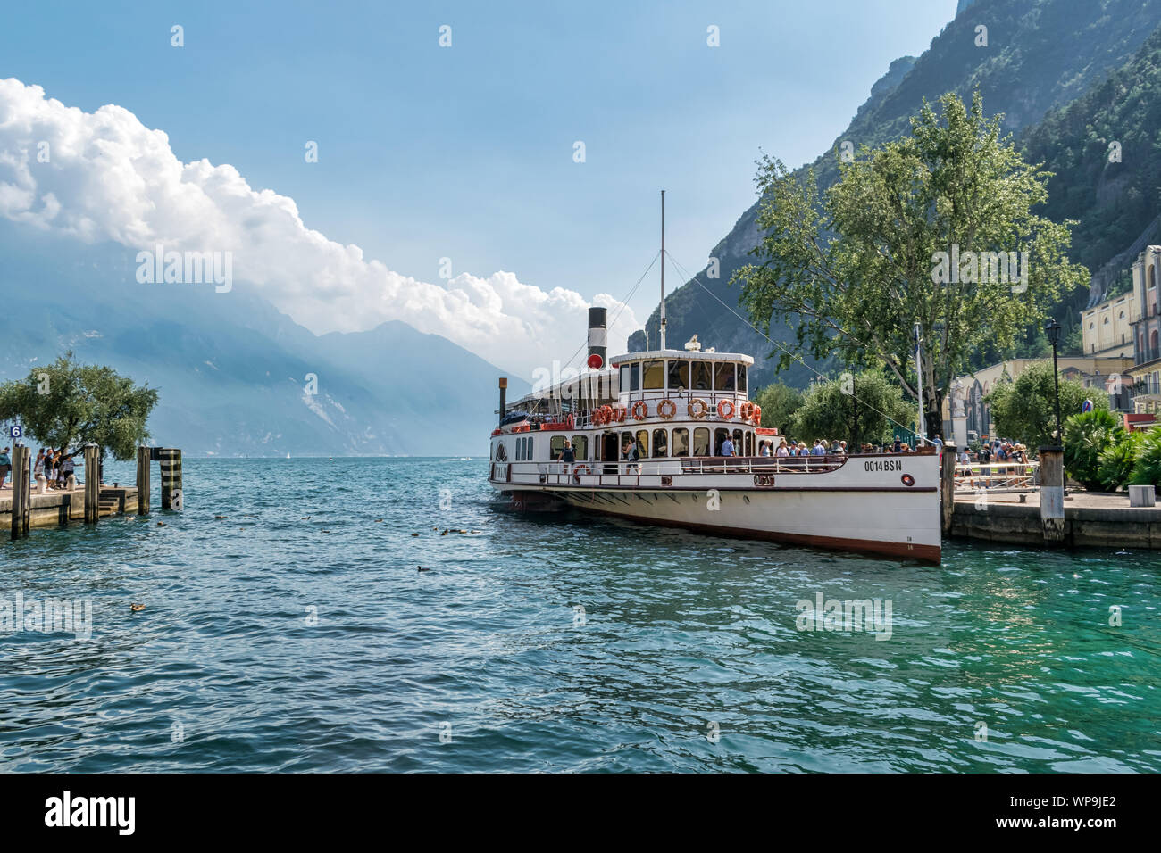 Riva del Garda, Italy -  Aug 1, 2019: An old paddle steamer boat on Lake Garda at Riva del Garda Stock Photo
