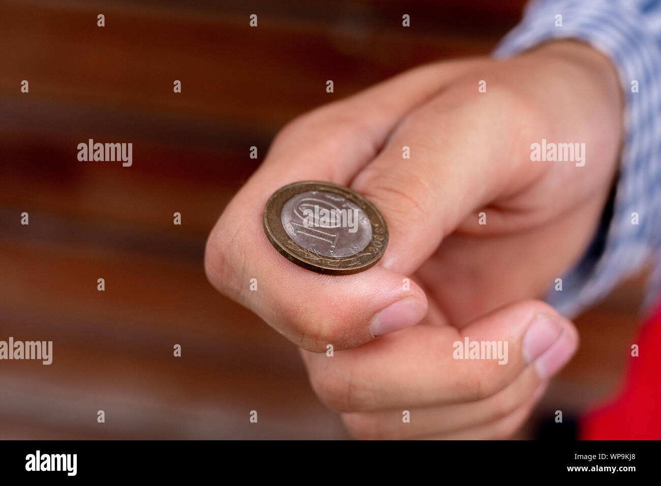 close up shot of hand toss a coin, probable and winning chances concept, fiftyfifty s Stock