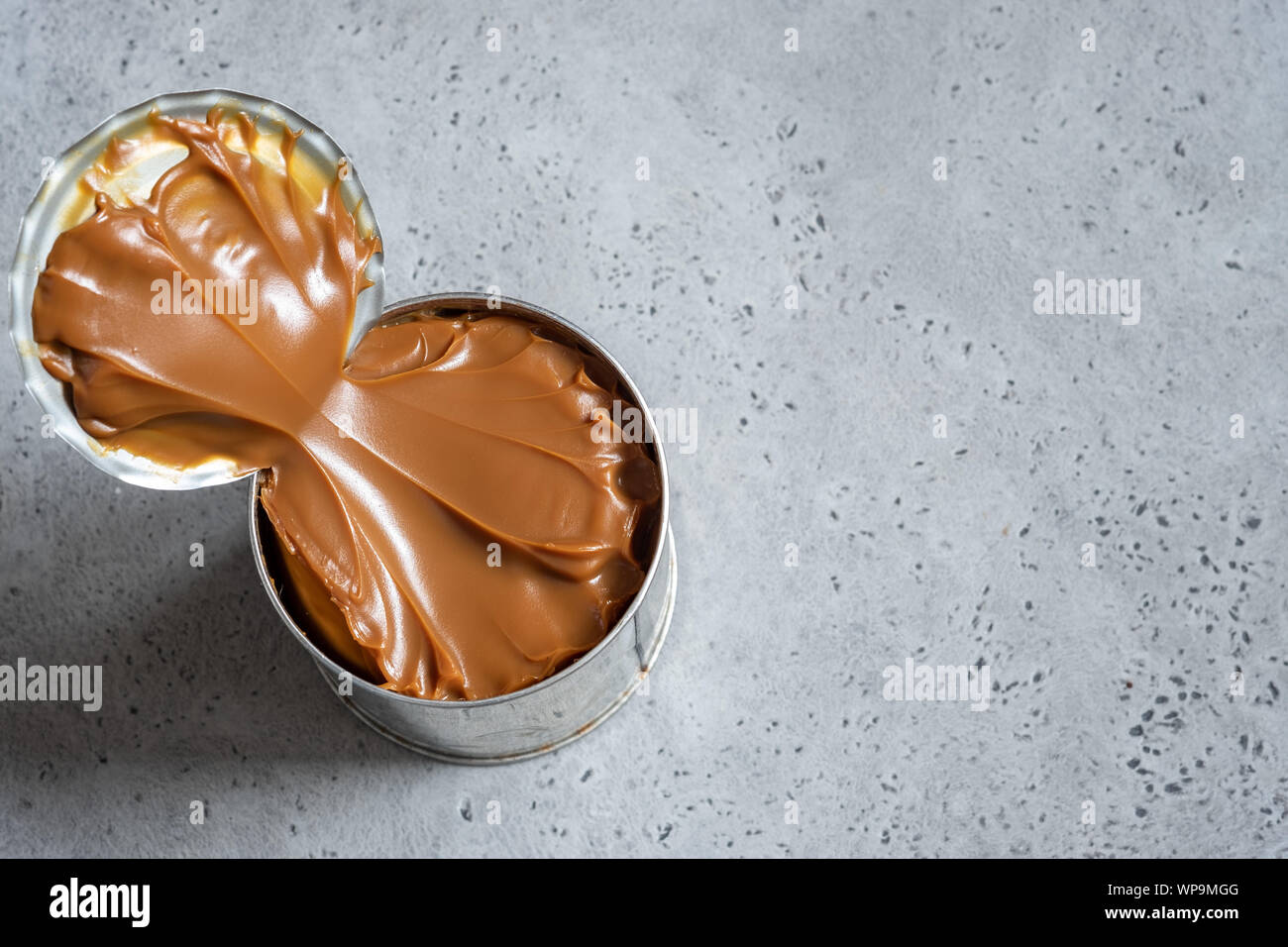 Dulce de leche, caramel condensed milk in a tin can Stock Photo Alamy