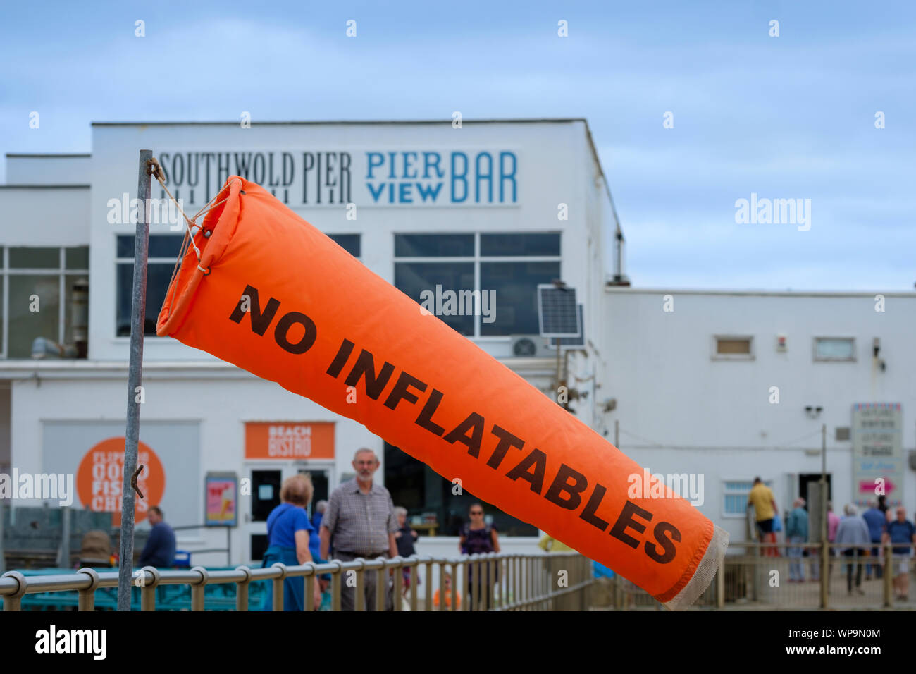 A windsock at the seaside warning not to use inflatables. Stock Photo