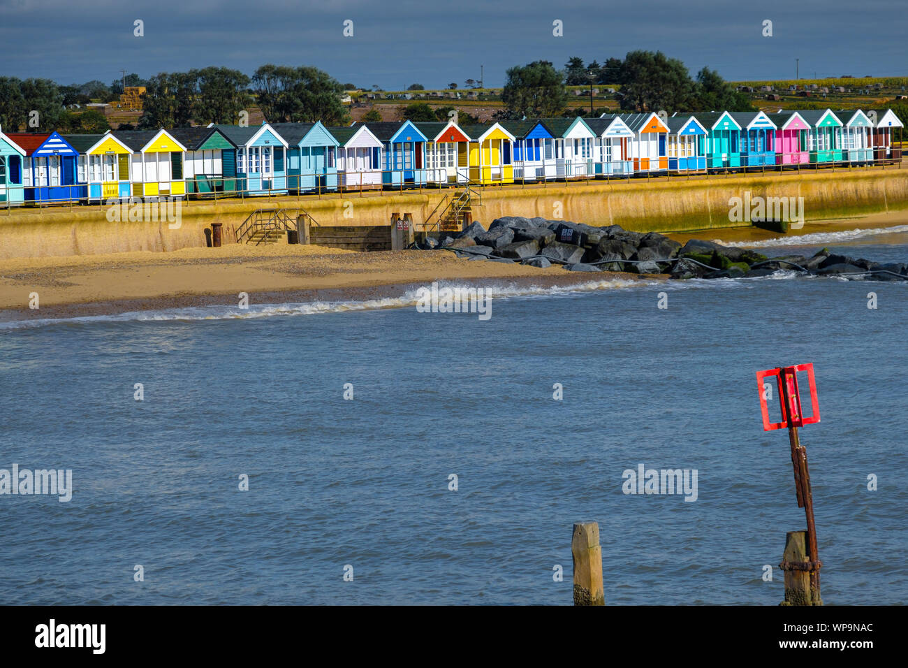Beach huts line the seafront at Southwold. Stock Photo