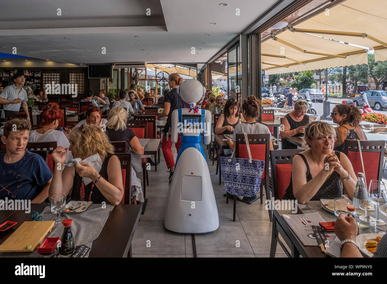 RAPALLO, ITALY - JULY 25: Waiter robot brings the dishes on July 25, 2019 in Rapallo, Italy. The 'Gran Caff Rapallo' restaurant in Liguria is the fir Stock Photo