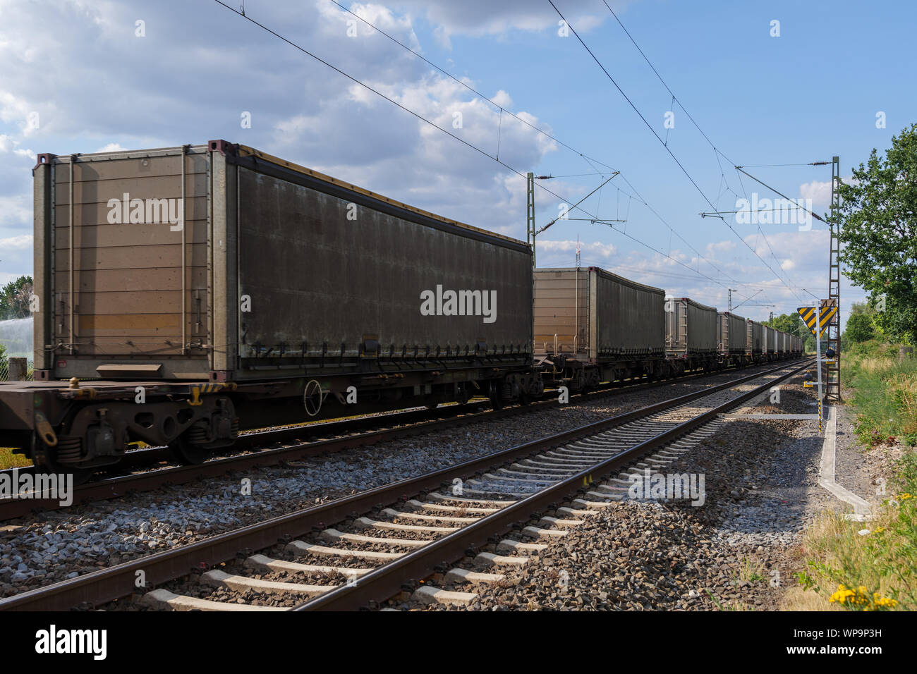 German Container Train Outdoor sunny view of container train or railway freight transportation ...