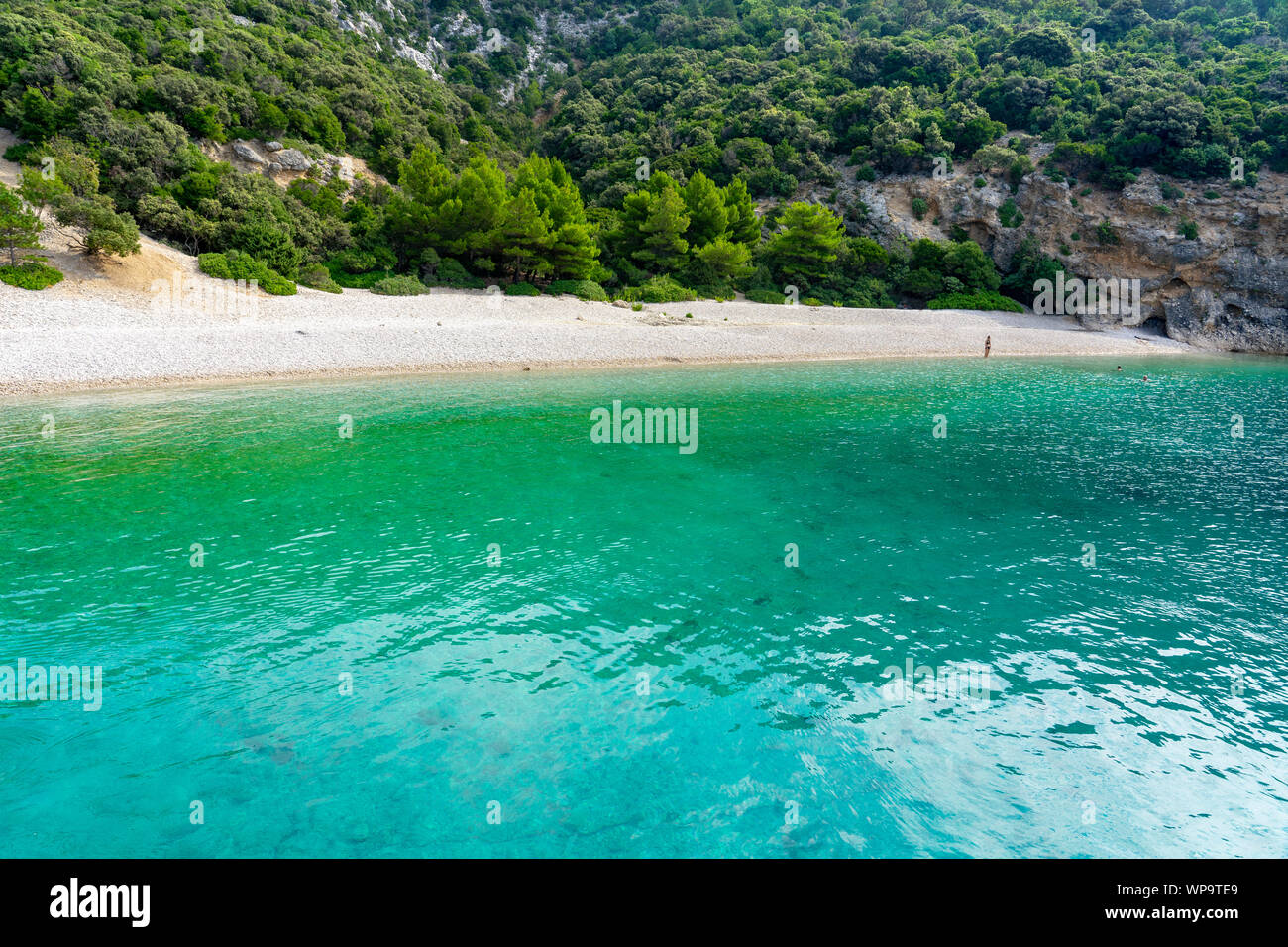 Hidden Lubenice beach in Cres island Croatia with crystal clear turquoise water Stock Photo