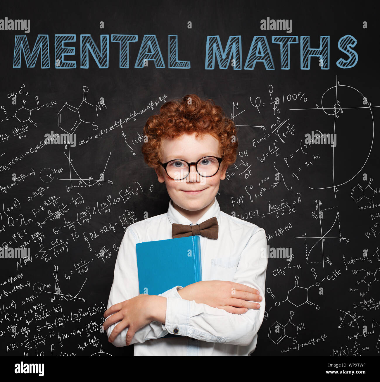 Curious child on school chalkboard background. Mental maths and early development concept Stock Photo
