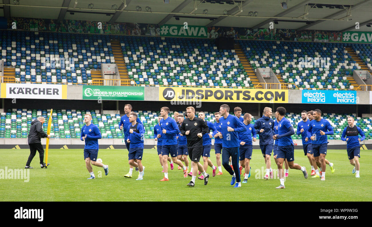 Belfast, Northern Ireland, UK. 08th Sep, 2019. Soccer: National team, final training Northern Ireland before the European Championship qualifier Northern Ireland - Germany in Windsor Park Stadium. The players warm up at the final practice. Credit: Christian Charisius/dpa/Alamy Live News Stock Photo