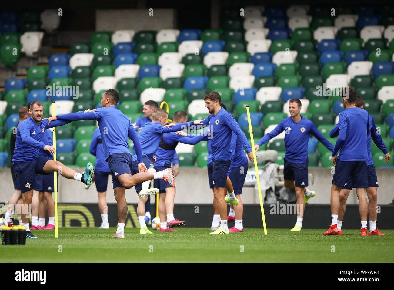 Belfast, UK. 08th Sep, 2019. Soccer: National team, final training Northern Ireland before the European Championship qualifier Northern Ireland - Germany in Windsor Park Stadium. The players warm up at the final practice. Credit: Christian Charisius/dpa/Alamy Live News Stock Photo