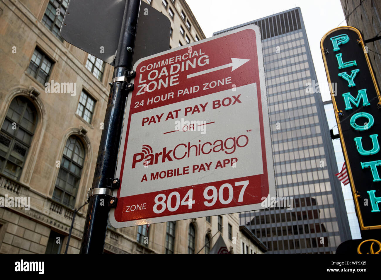 commercial loading zone 24 hour paid zone mobile pay app sign Chicago Illinois USA Stock Photo