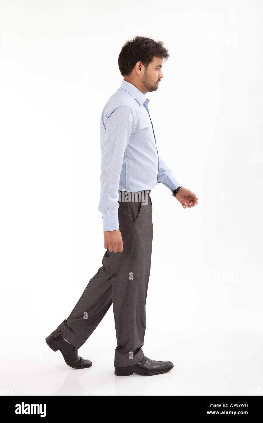 Indian man walking side view hi-res stock photography and images - Alamy