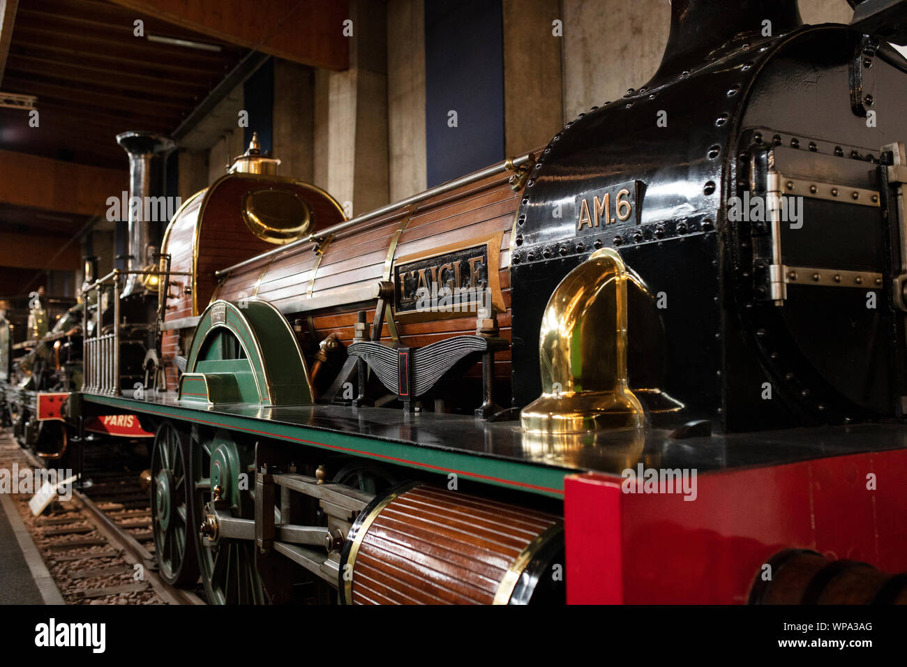 A type 111 Stephenson steam locomotive, no. 6 L'Aigle, Compagnie d'Avignon à Marseille, from 1846, at the Cité du Train museum in Mulhouse, France. Stock Photo