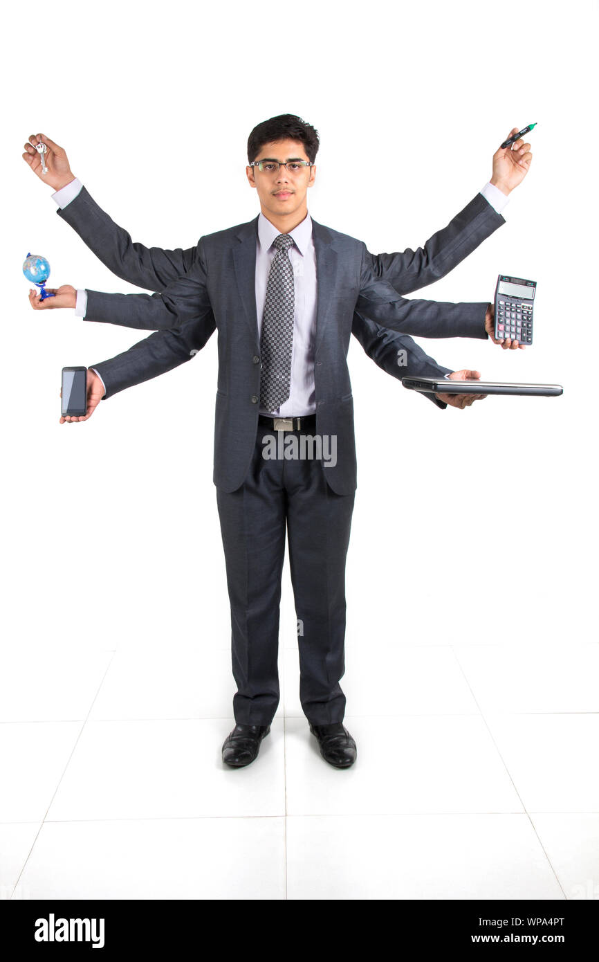 Businessman showing equipments with multiple hands Stock Photo