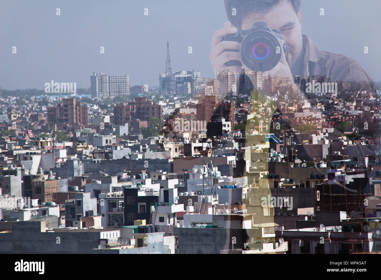 Double exposure of photographer taking picture at city Stock Photo