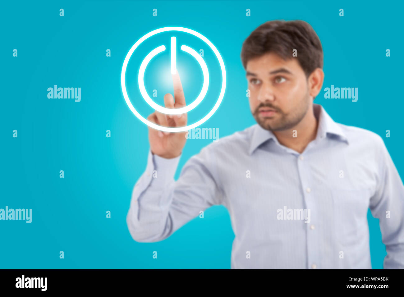 Businessman touching power button on advanced touch screen interface Stock Photo