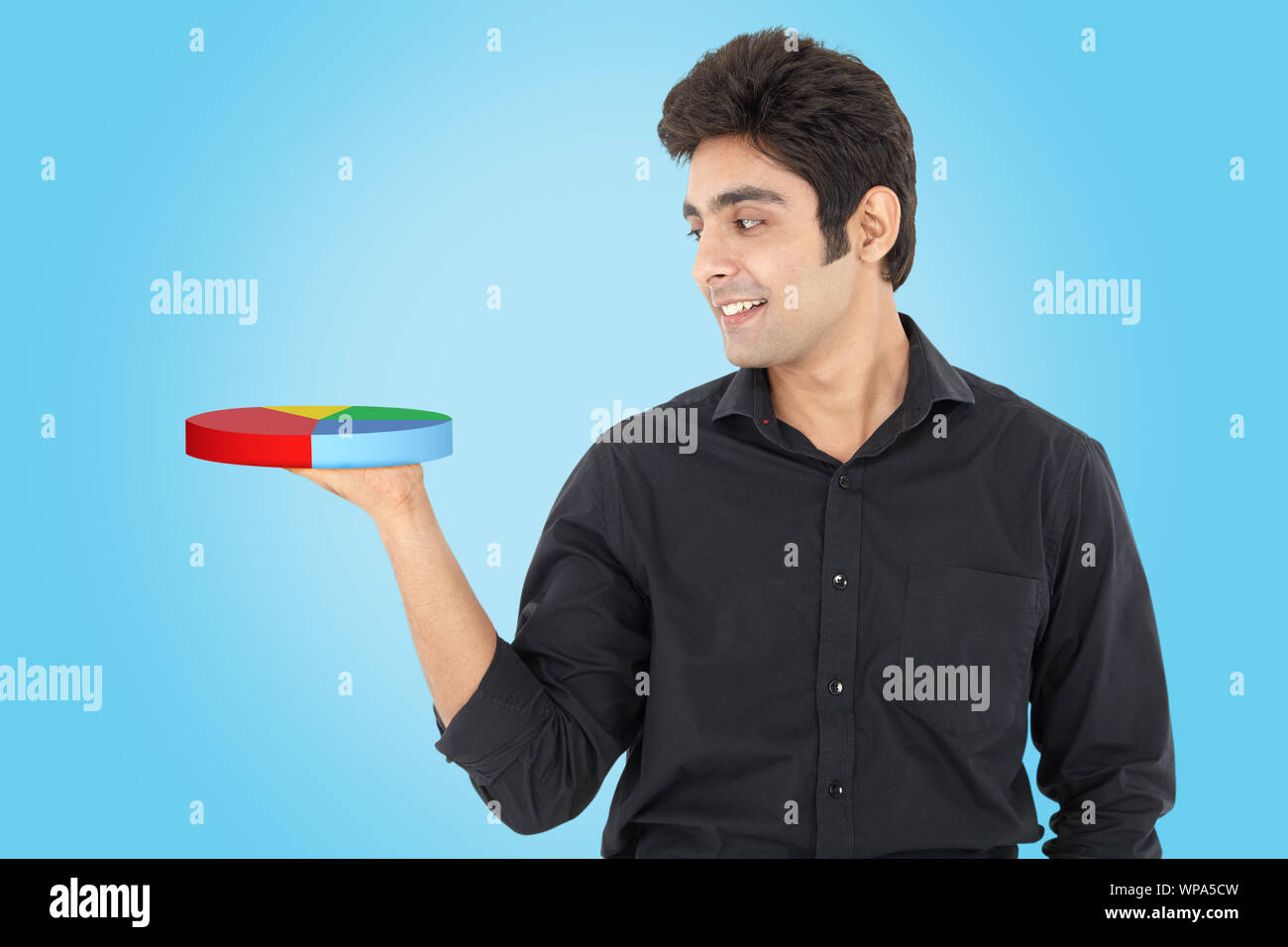 Businessman showing pie chart Stock Photo
