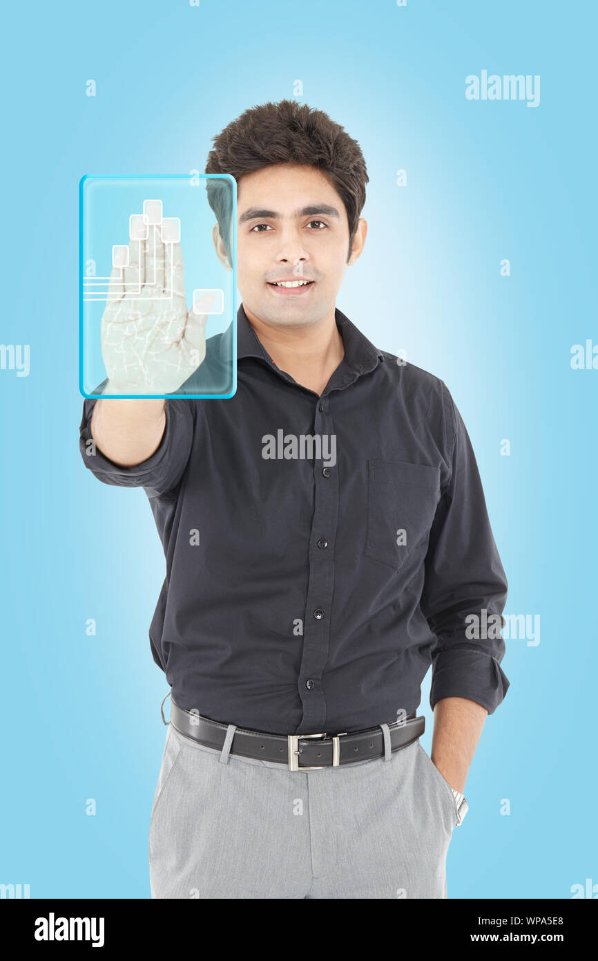 Businessman using a touch screen for biometrics identification Stock Photo