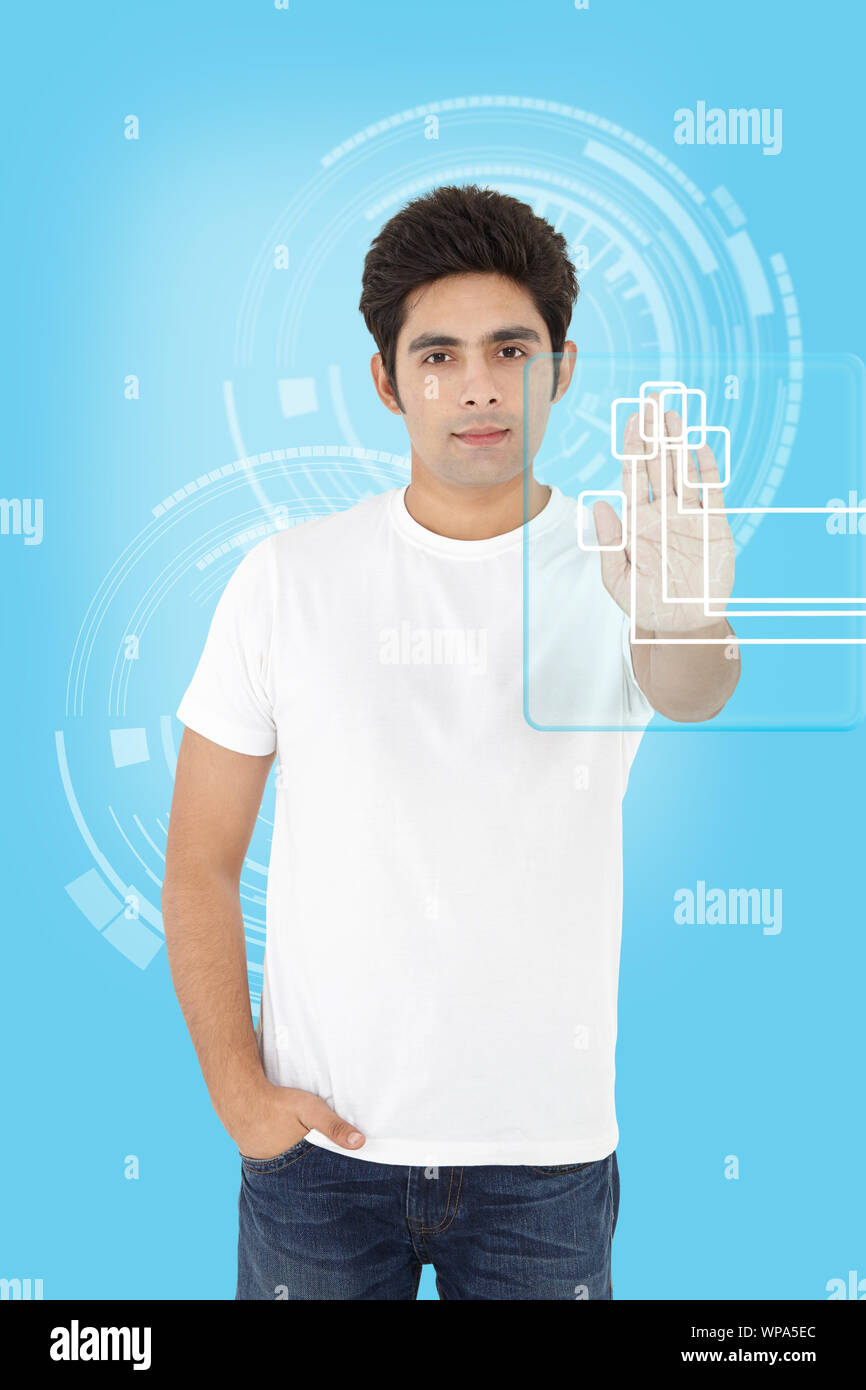 Young man using a touch screen for biometrics identification Stock