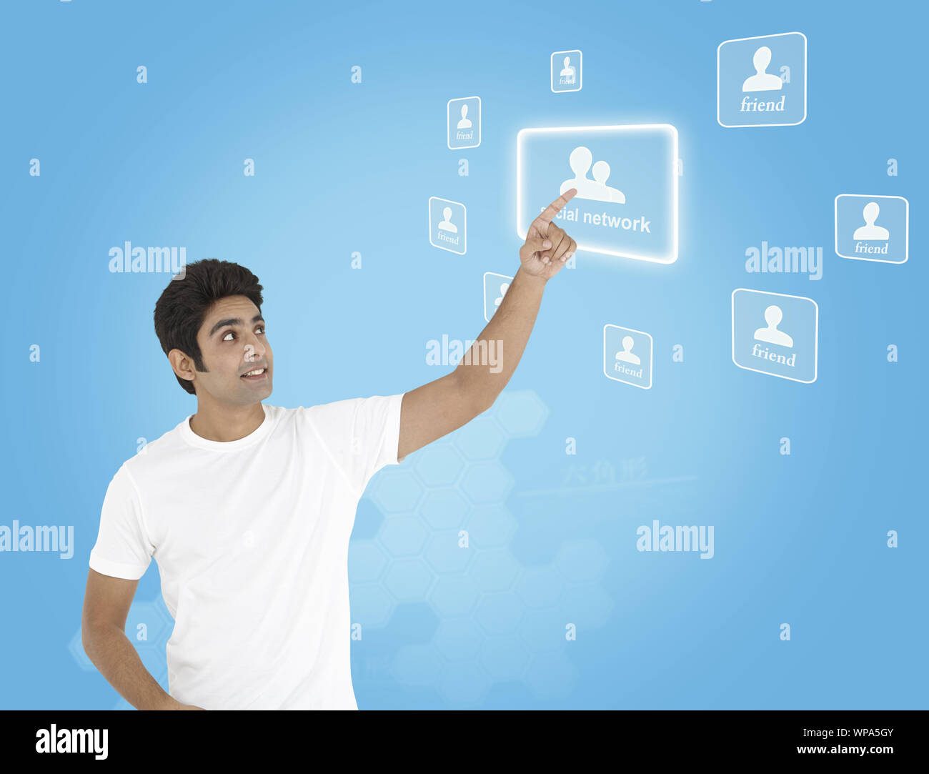 Young man using a touch screen and smiling Stock Photo