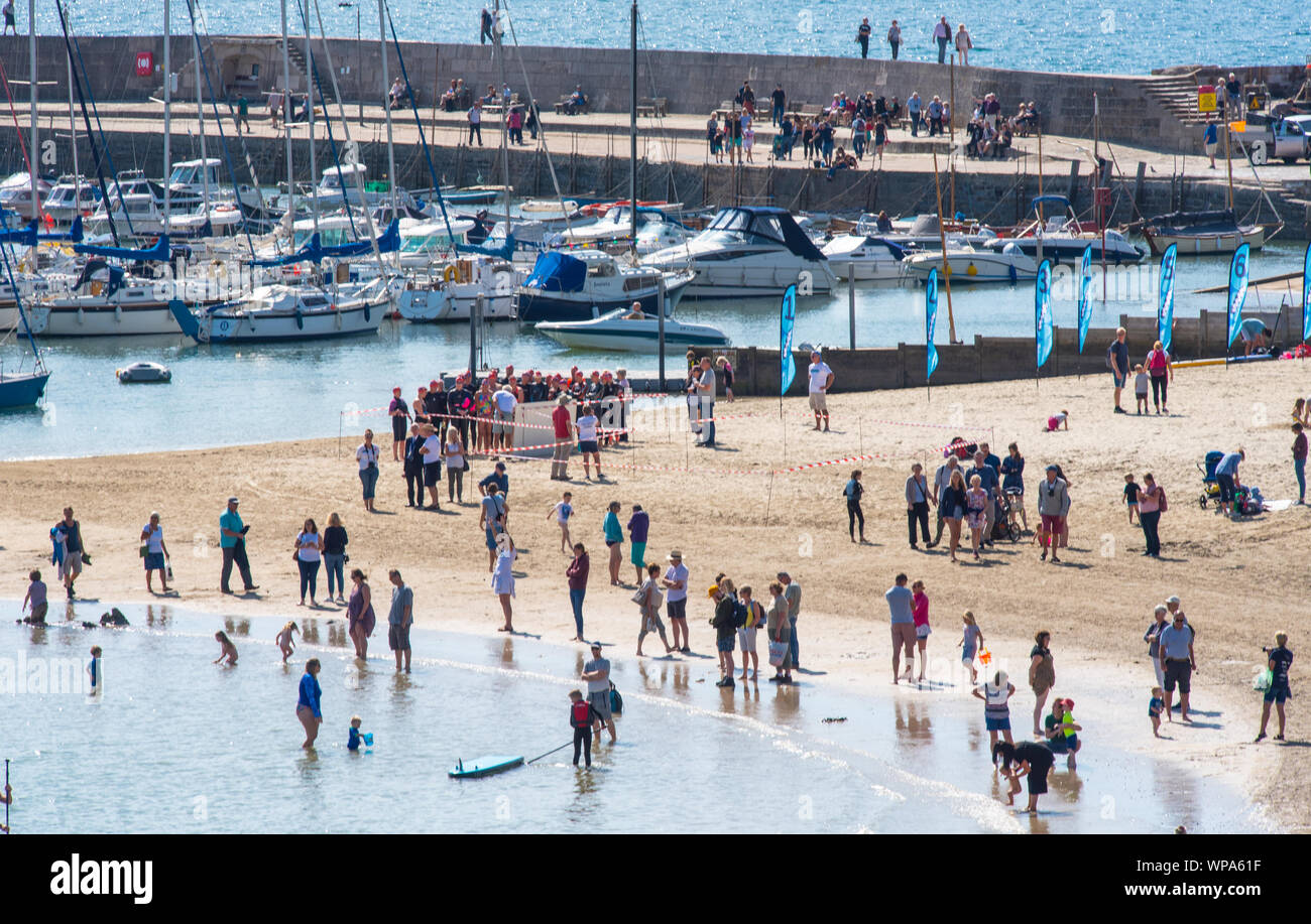 Lyme Regis, Dorset, UK. 8th September 2019. UK Weather: Crowds flock to the beach at the seaside resort of Lyme Regis to enjoy an afternoon of glorious warm sunshine. Credit: Celia McMahon/Alamy Live News Stock Photo