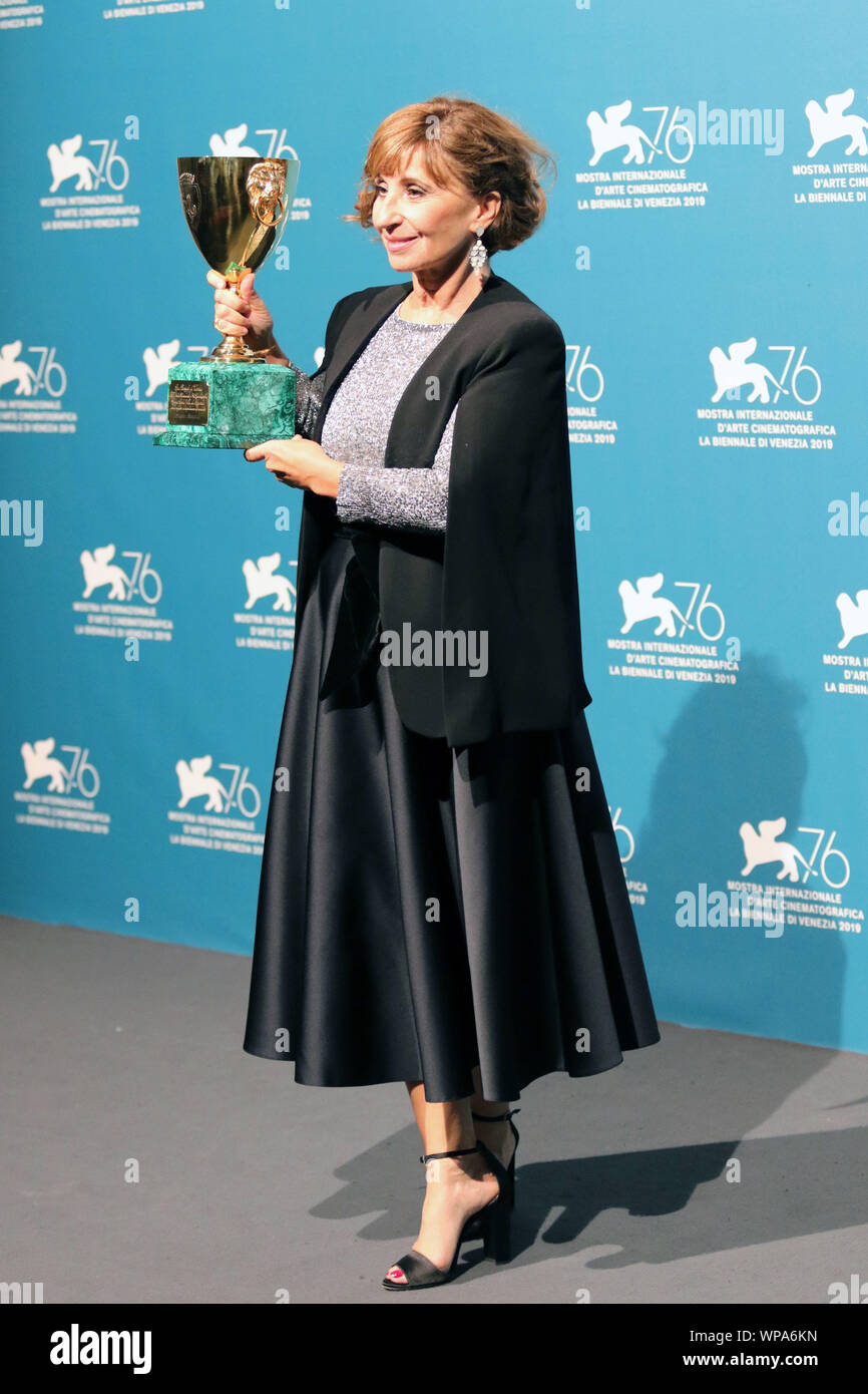 Italy, Lido di Venezia, September 7, 2019 : The french actress Ariane Ascaride poses with the Coppa Volpi for Best Actress Award for 'Gloria Mundi' at Stock Photo