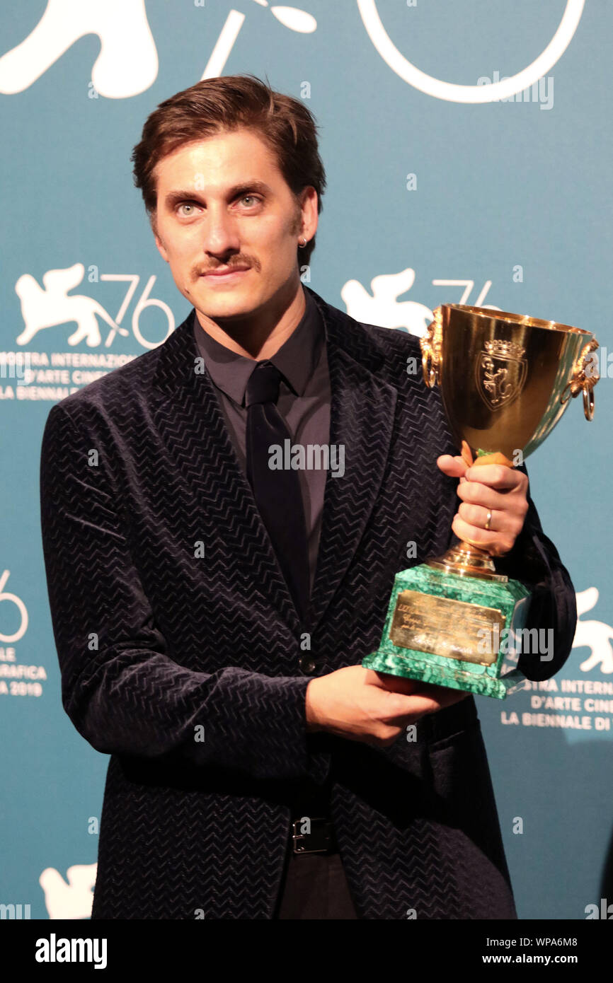 Italy, Lido di Venezia, September 7, 2019 : The italian actor Luca Marinelli poses with the Coppa Volpi for Best Actor Award for 'Martin Eden' at the Stock Photo