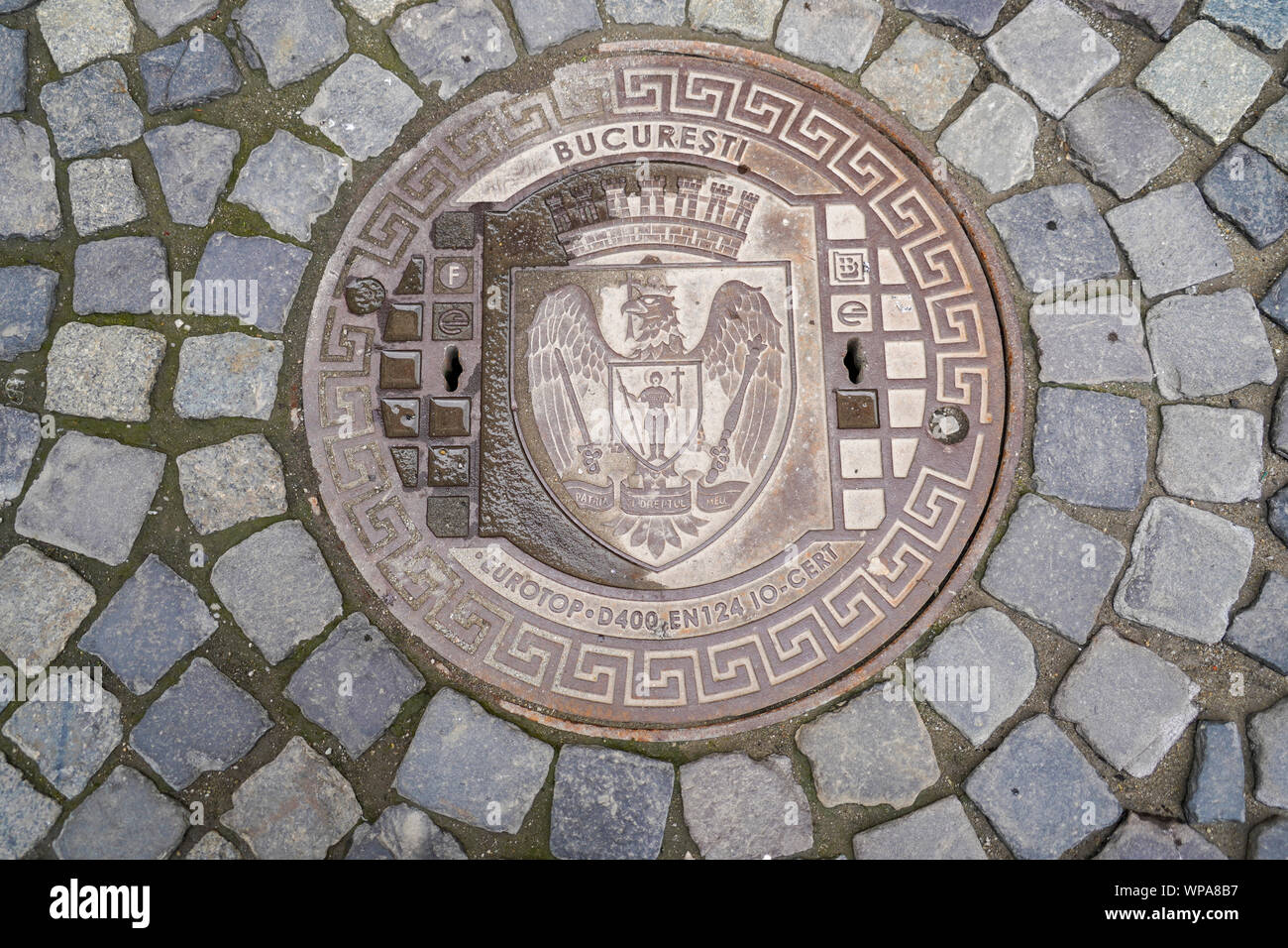 The coat of arms of Bucharest, Romania on a manhole cover Stock Photo