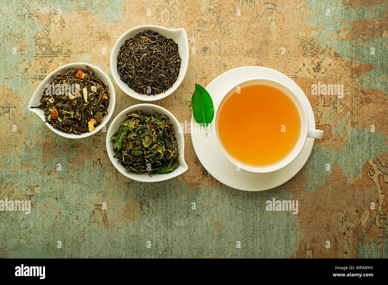 Cup of tea with dry tea collection of different types classic black