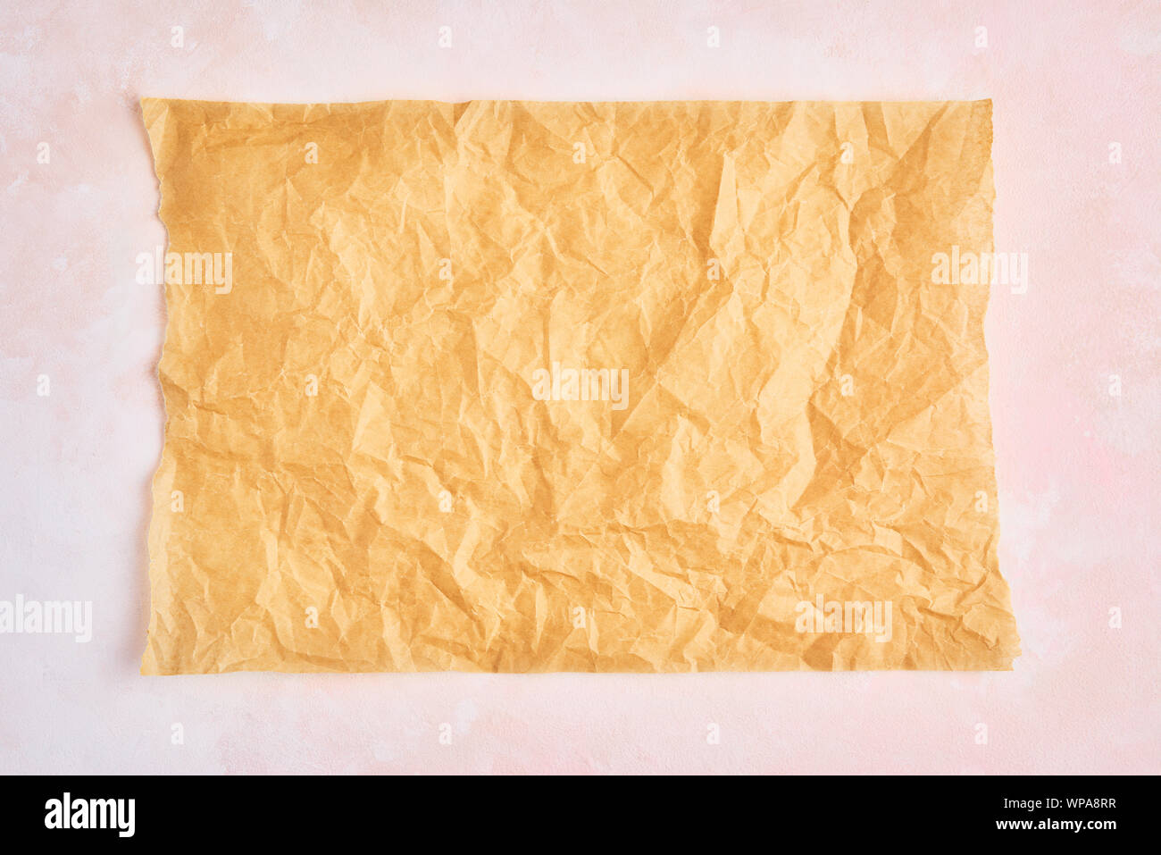 https://c8.alamy.com/comp/WPA8RR/crumpled-piece-of-brown-parchment-or-baking-paper-on-rose-and-white-texture-pattern-background-top-view-copy-space-for-text-and-design-element-WPA8RR.jpg