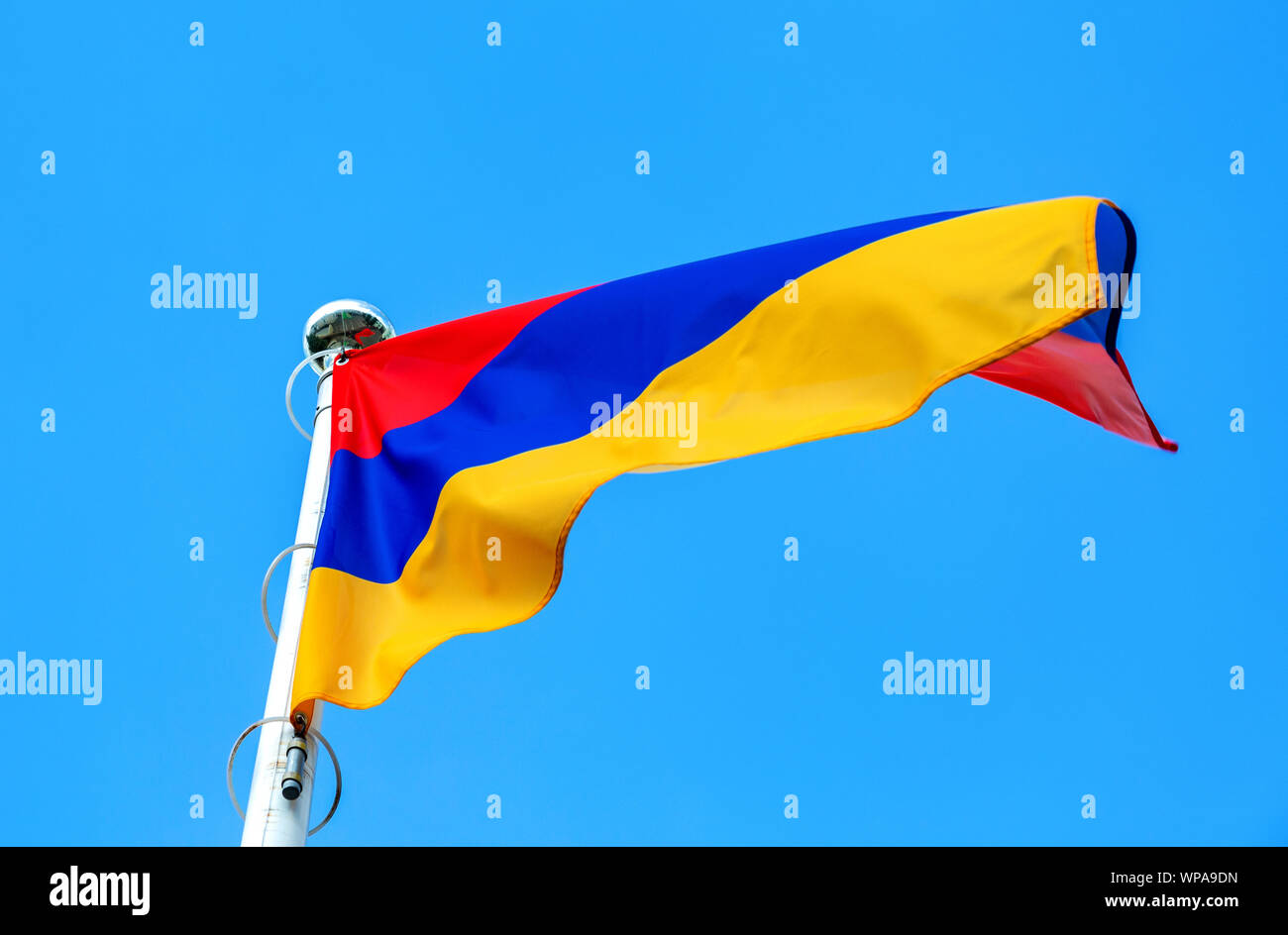National flag of Armenia waving in the wind against the blue sky Stock ...