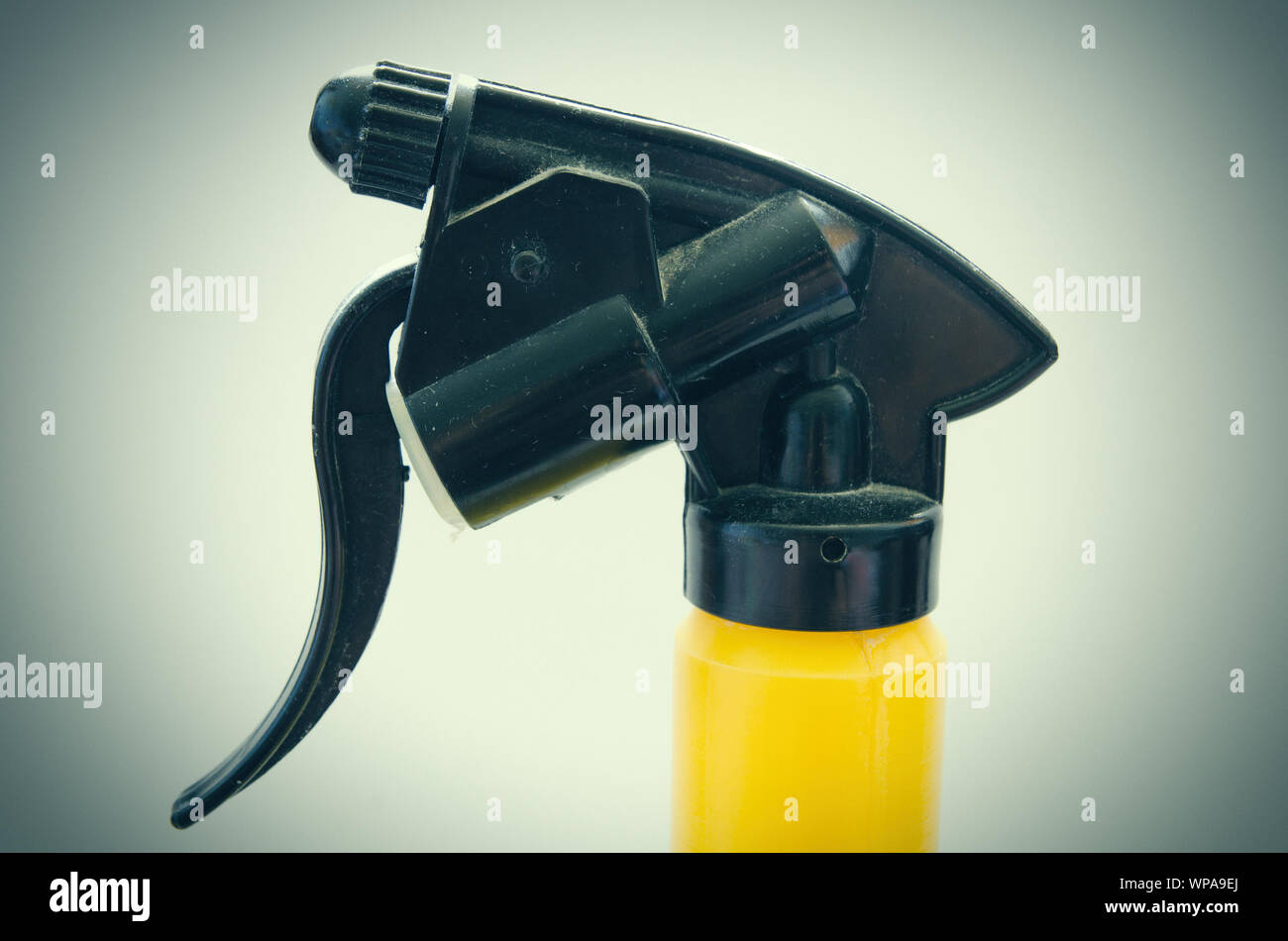 yellow water sprayer with black trigger Stock Photo
