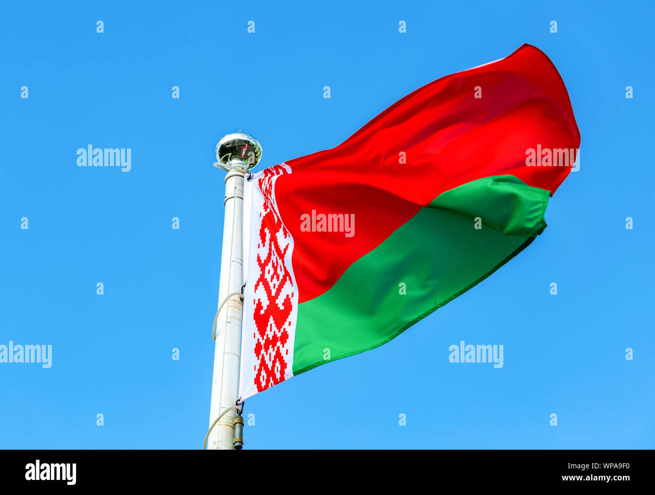 National flag of Belarus waving in the wind against the blue sky Stock ...