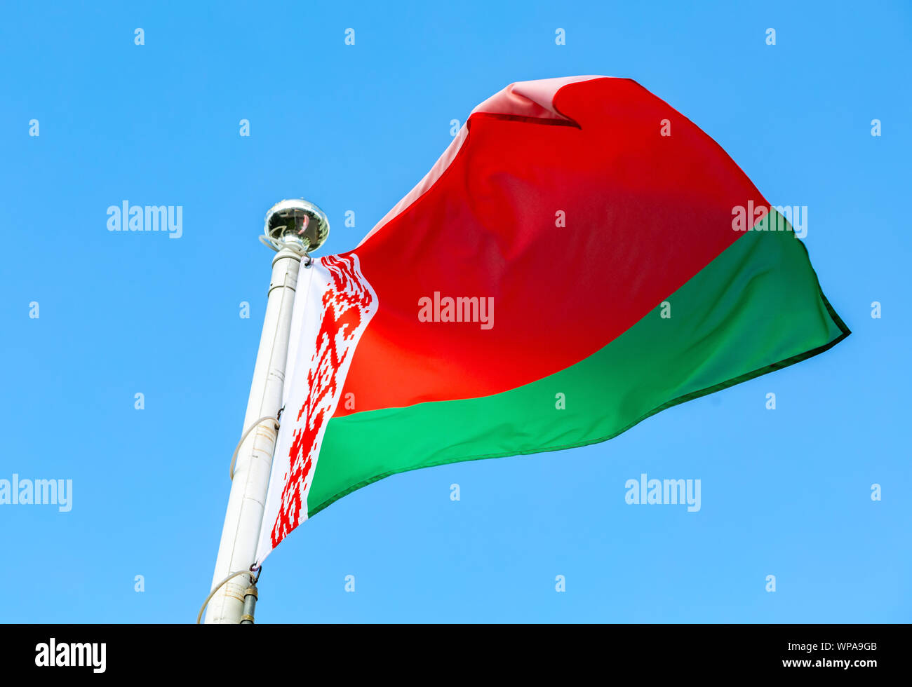 National flag of Belarus waving in the wind against the blue sky Stock ...
