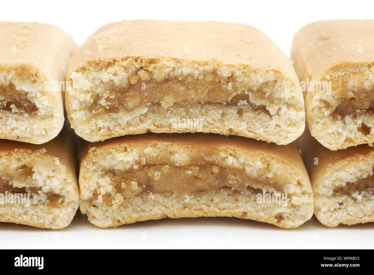 Apple date bars arranged to show the sweet filling inside.  The bars are isolated on white background. Stock Photo