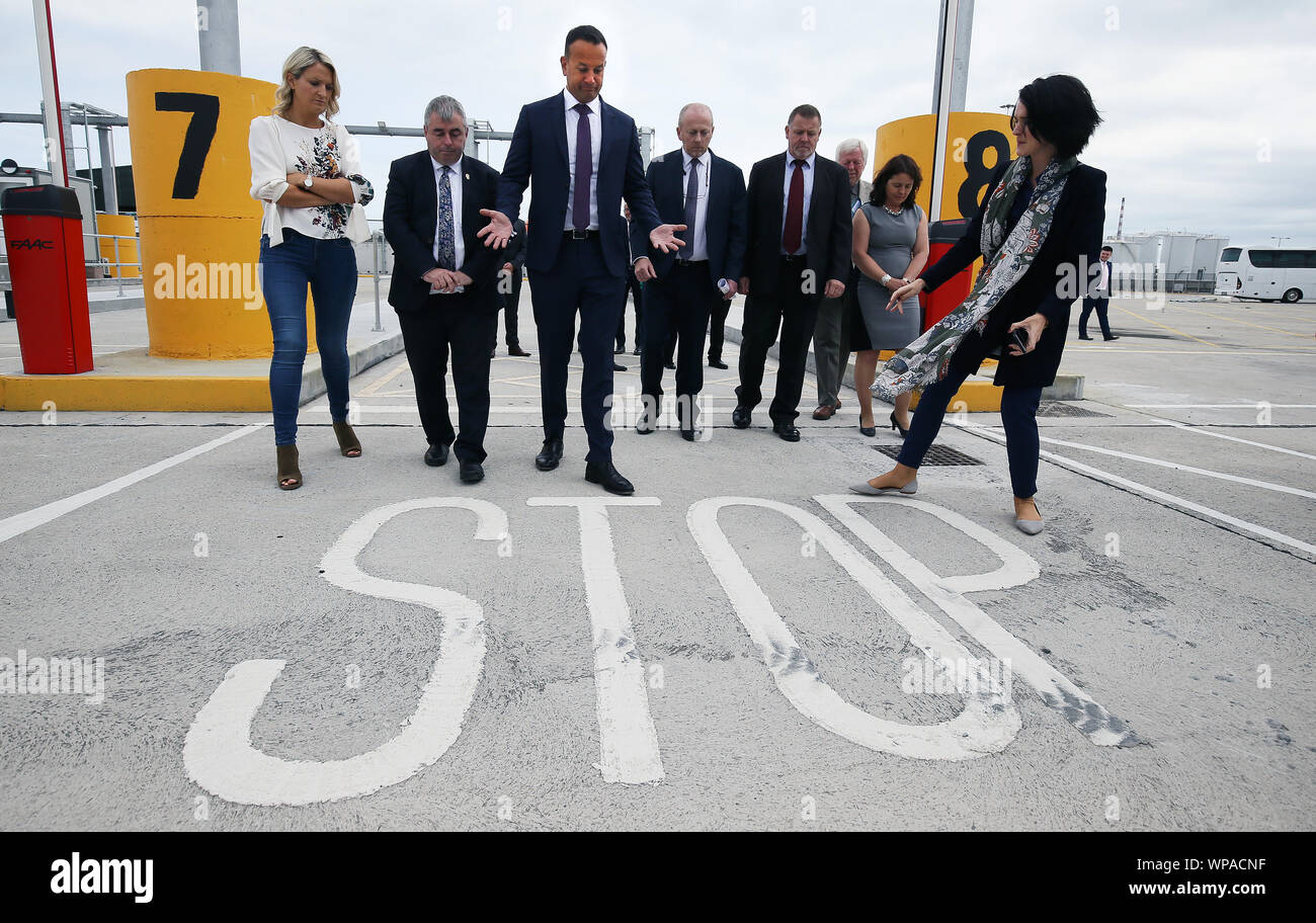 Taoiseach Leo Varadkar (third left) and European Affairs Minister Helen McEntee (left) with port and customs officials during a visit to new physical infrastructure at Dublin Port which has been put in place to meet the requirements for customs, SPS and health checks on consignments of goods imported from or transiting the UK. Stock Photo
