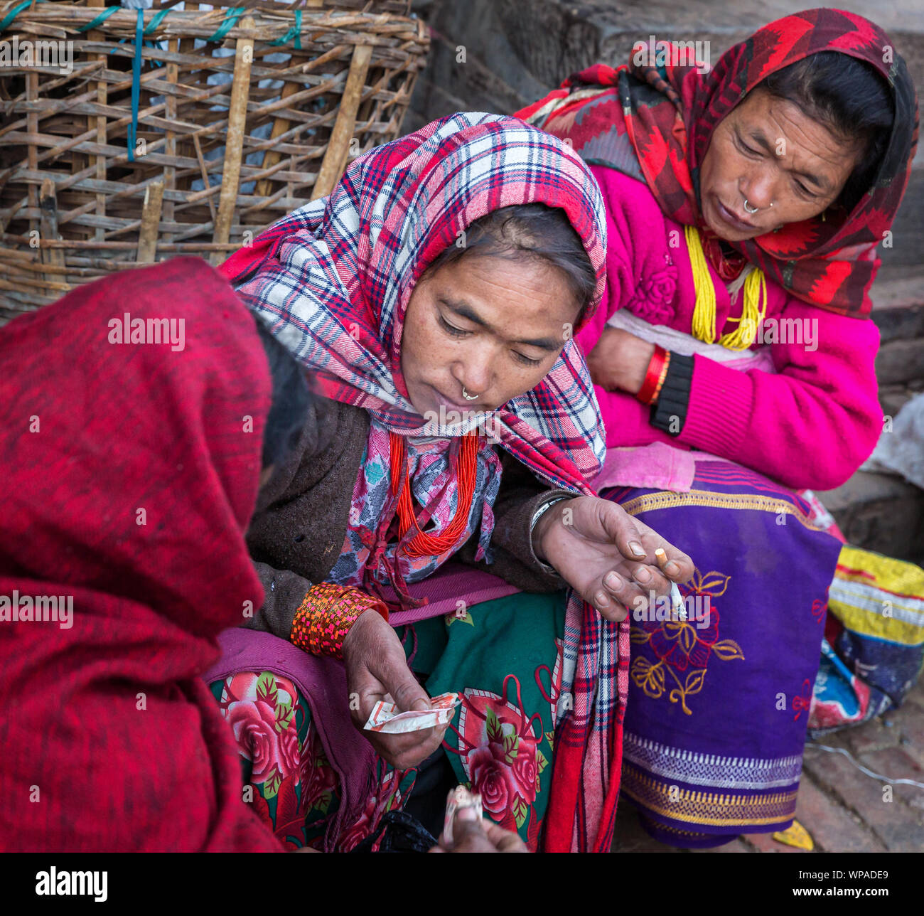 Women exchanging money, Bhaktapur, Nepal Stock Photo