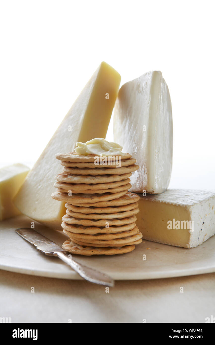 Cheese crackers and spread appetizers on marble plate Stock Photo Alamy